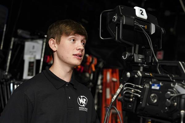 MULTIMEDIA TECHNOLOGY students working with cameras